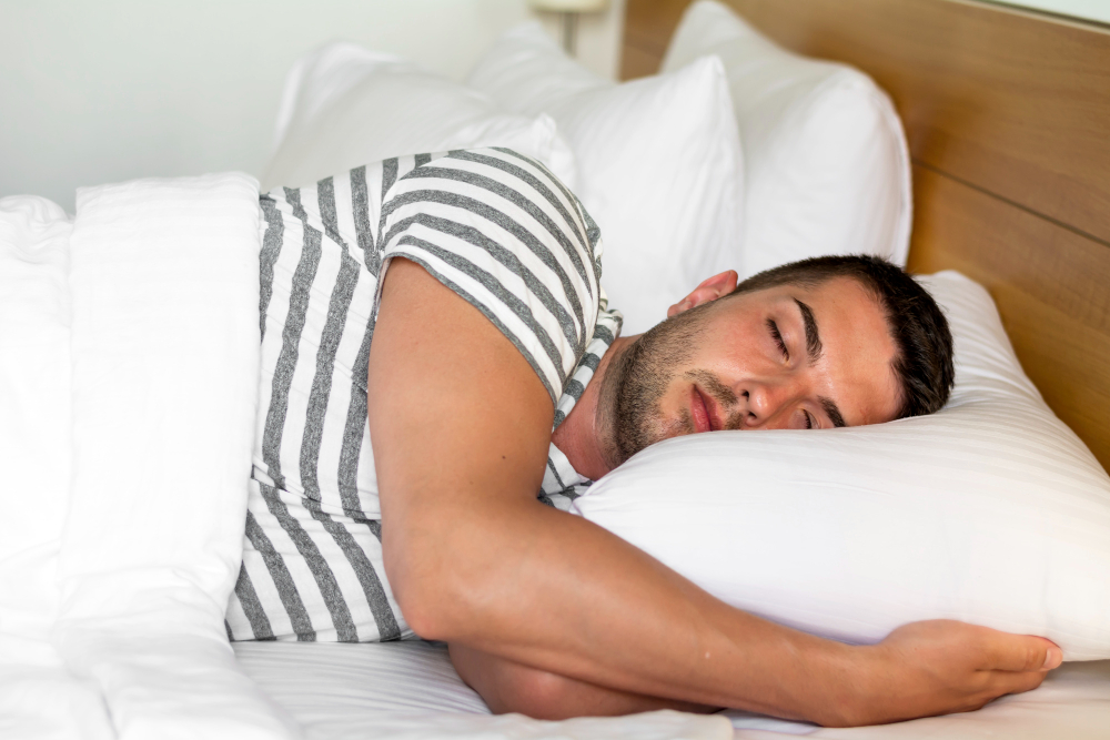 Person receiving chiropractic treatments to improve sleep and relieve lower back pain.