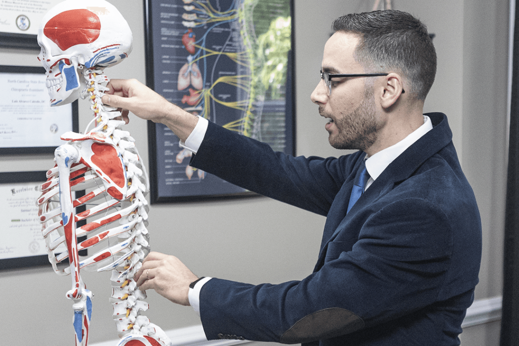 A person performing stretching exercises in front of a wall to improve posture and relieve muscle pain.