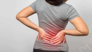 Patient receiving a spinal adjustment to relieve lower back pain at a chiropractic clinic.