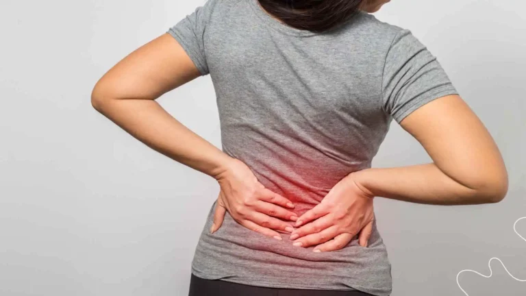 Patient receiving a spinal adjustment to relieve lower back pain at a chiropractic clinic.