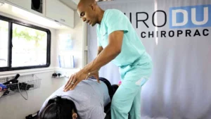 Person receiving chiropractic adjustment after an automobile accident, representing post-accident chiropractic treatment.