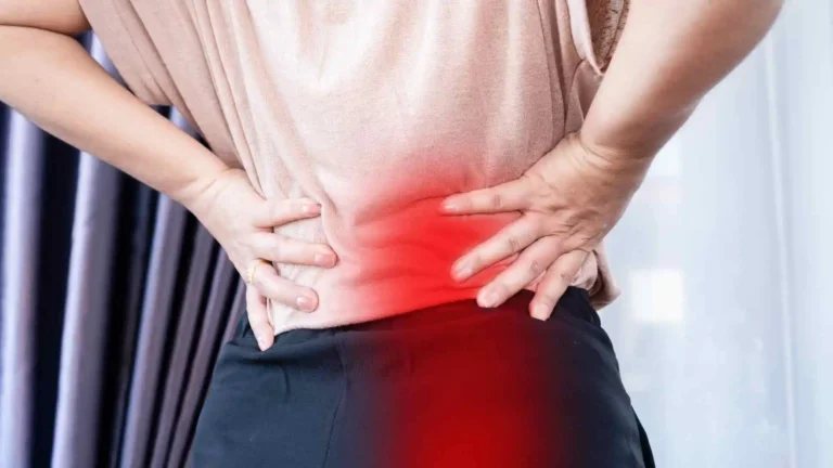 Person touching lower back and leg, representing sciatic pain and need for natural relief.