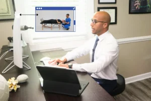 Chiropractic clinic near me with chiropractor evaluating a patient prior to spinal adjustment.